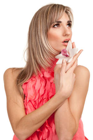 Beautiful blond girl with orchid flower isolated on white background の写真素材