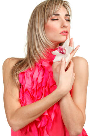 Beautiful blond girl with orchid flower isolated on white background の写真素材