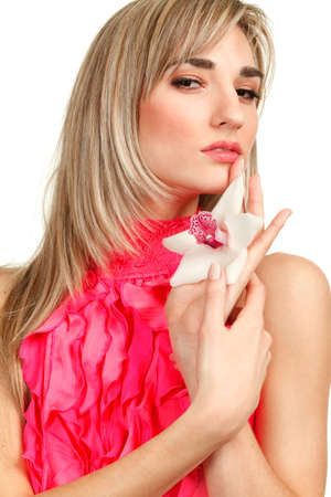 Beautiful blond girl with orchid flower isolated on white background の写真素材