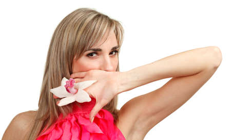 Beautiful blond girl with orchid flower isolated on white background の写真素材