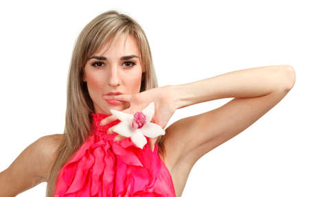 Beautiful blond girl with orchid flower isolated on white background の写真素材