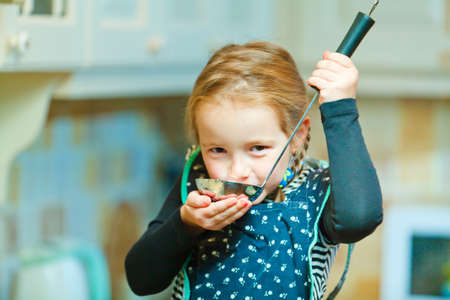 Little girl cookingの写真素材