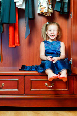 Child hiding in wardrobeの写真素材