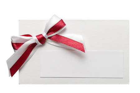 close up of card note with ribbon on white background の写真素材