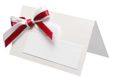 close up of card note with ribbon on white backgroundの写真素材