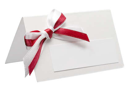 close up of card note with ribbon on white backgroundの写真素材