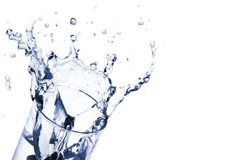 water splash in glass isolated on white