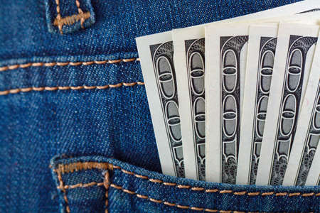 dollars in a jeans pocket