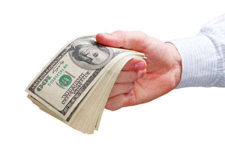businessman holds his profit or wages isolated on whiteの写真素材