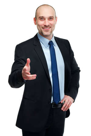 Smiling handsome business man greeting you isolated on whiteの写真素材