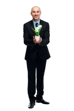 picture of handsome man with flower pot in handの写真素材