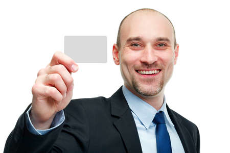 Business man handing a blank business card over white backgroundの写真素材