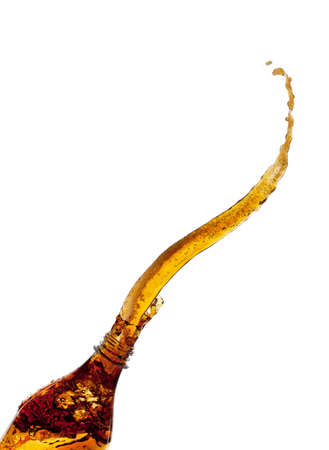 Cola splash from a bottleの写真素材