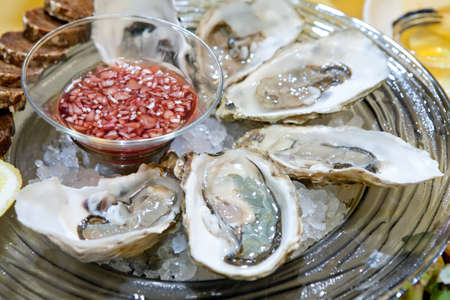 fresh oysters on the ice plateの写真素材