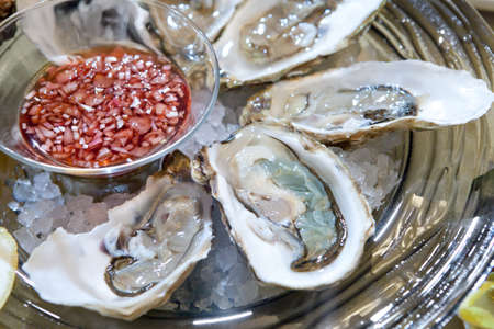fresh oysters on the ice plateの写真素材