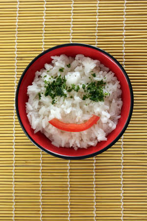 Chinese food in a black plate and sticksの写真素材