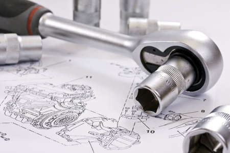  ratchet spanner and sockets on technical draw backgroundの写真素材