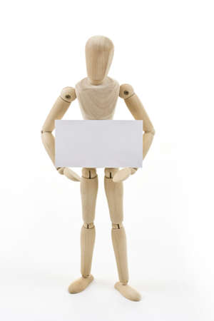 Mannequin holding up blank card isolated in white backgroundの写真素材