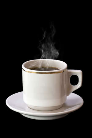 Cup of hot drink with steam over black background の写真素材