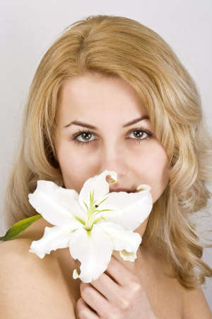 portrait of beautiful young woman with spring flowers の写真素材