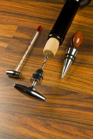 Opening a wine bottle with corkscrew and accesoriesの写真素材