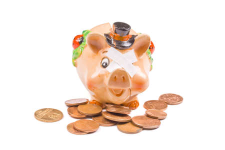Piggy bank with stacks of coins の写真素材