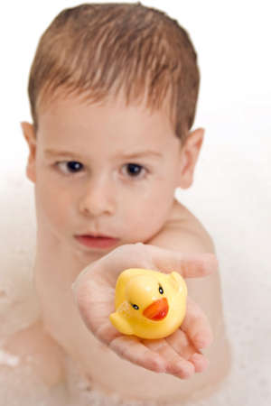 Boy playing in the waterの写真素材