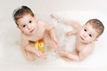 Boys playing in the waterの写真素材