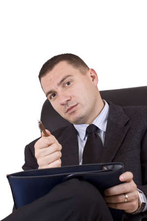 young business man contemplating over white backgroundの写真素材