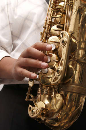 Jazz saxophone player playing a solo at a concertの写真素材