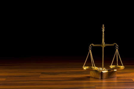 old balance  in wood backgroundの写真素材