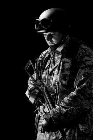 soldier holding a gun, isolated in black, monochromeの写真素材