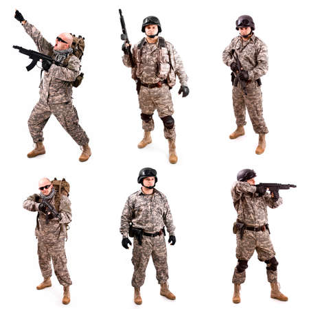 soldier coolage holding a gun, isolated in whiteの写真素材