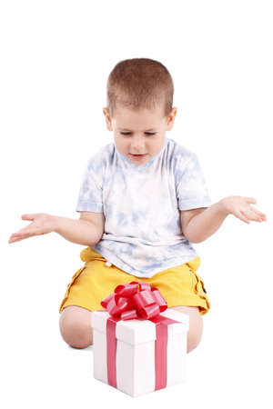 Little boy whit a gift box isolated on white の写真素材