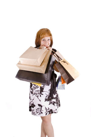 lovely woman with shopping bags over white の写真素材