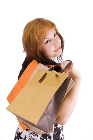 Portrait of an young woman holding several shoppingbag の写真素材