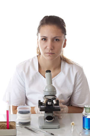 Scientist and microscope in laboratoryの写真素材