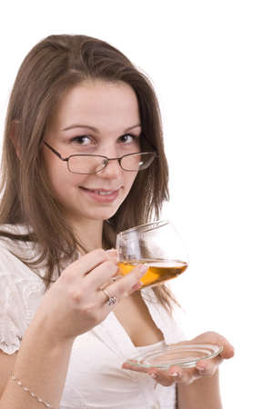 Beautiful woman drinking a cup of teaの写真素材