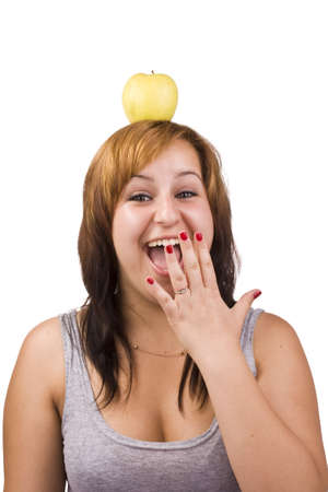 A pretty young woman whit apple in headの写真素材