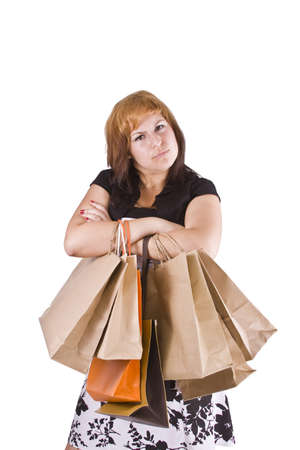 lovely woman with shopping bags over white の写真素材