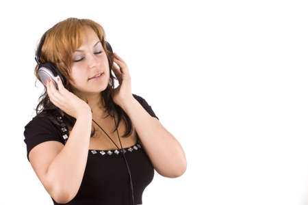 beautiful happy woman listening to music の写真素材