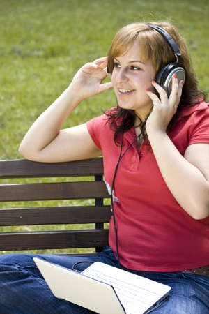 beautiful happy woman listening to music の写真素材