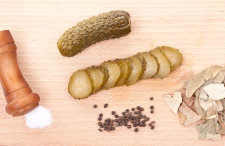 Sliced fermented cucumber served on wood plateの写真素材