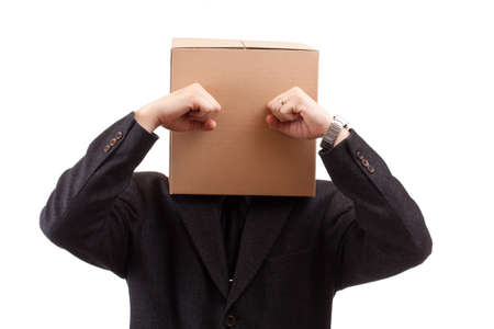 Businessman with a brown box on his headの写真素材