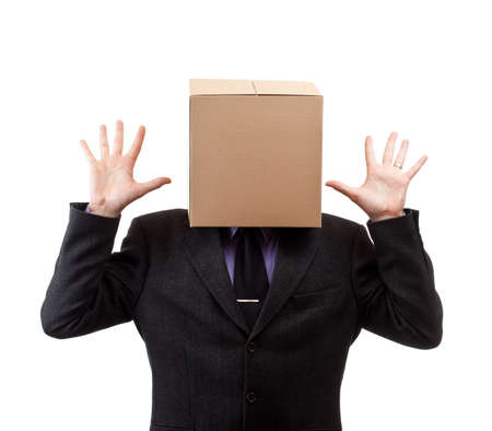 Businessman with a brown box on his head, in whiteの写真素材