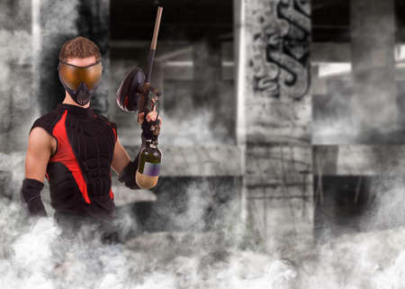Closeup paintball player, whit grunge backgroundの写真素材