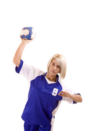 female handball player with a used ball make exerciseの写真素材