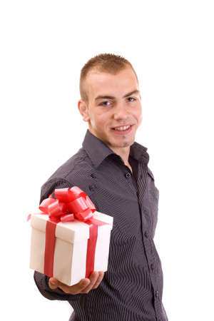 young man with a wrapped gift box for you (selective focus) の写真素材