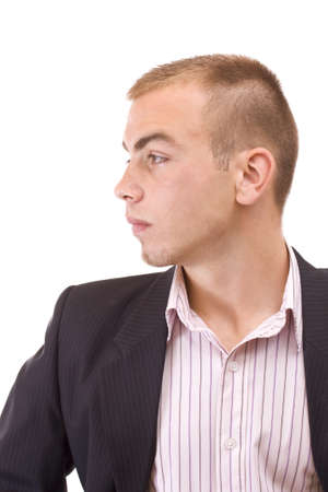 Portrait of a smiling young businessman standing against isolated white background の写真素材