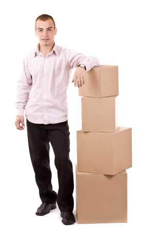 Man relaxing on lots of cardboard boxesの写真素材